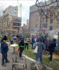 a daytime photo of people enjoying the garden event