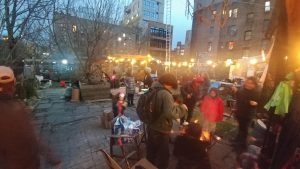 an evening photo of people enjoying the garden event